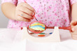 Foto: Child painting Easter eggs Child painting Easter eggs