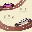 two vintage cars on the road