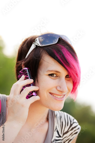 Photo: Punk woman on a cell phone Punk woman on a cell phone