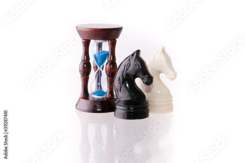 Photo: Two chess horses with sand-clock Two chess horses with sand-clock