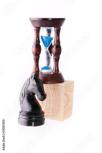 Photo: Black chess horse with sand-clock Black chess horse with sand-clock