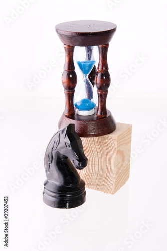 Photo: Black chess horse with sand-clock Black chess horse with sand-clock