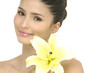 Close up girl holding lily flower in her hands
