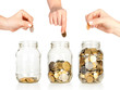 Glass banks for tips with money like diagram and hand