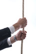 business man with rope isolated on white background