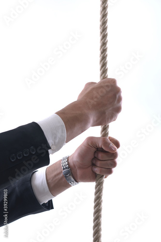 Photo: business man with rope isolated on white background business man with rope isolated on white background