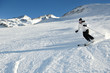 skiing on fresh snow at winter season at beautiful sunny day