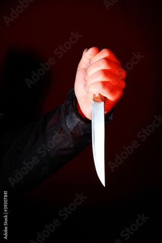 Photo: Hand with knife Hand with knife