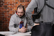 Police officer interrogates detainee