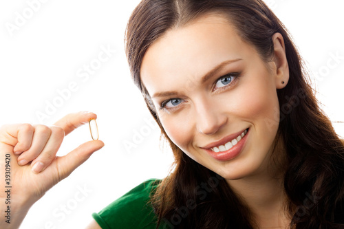 Photo: Woman with Omega 3 fish oil capsule, on white Woman with Omega 3 fish oil capsule, on white