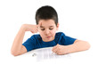 Photo: Child thinking for an answer isolated on white background. Child thinking for an answer isolated on white background.