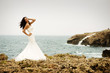 Bride in front of the sea