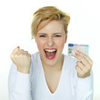 Foto: Young woman is so happy getting a driver licence Young woman is so happy getting a driver licence