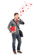 Smiling boy holding books and talking for love