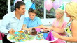 Video: Attractive Caucasian Family Enjoying Birthday Cake Attractive Caucasian Family Enjoying Birthday Cake