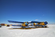 Old airplanes parked on a meadow with snow Old airplanes parked on a meadow with snow