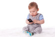Photo: Sweet small baby with mobile phone. Sweet small baby with mobile phone.