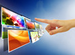 Foto: hand reaching images streaming from the deep over sky blue backg hand reaching images streaming from the deep over sky blue backg