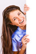 Photo: Attractive girl with braces presenting empty board Attractive girl with braces presenting empty board