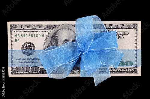 Photo: close up shot of dollar bill background with ribbon close up shot of dollar bill background with ribbon
