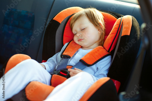 Photo: baby girl in car baby girl in car