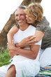 Mature couple smiling and embracing.