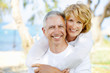 Foto: Mature couple smiling and embracing. Mature couple smiling and embracing.