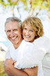 Mature couple smiling and embracing.