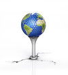 Golf ball with the texture of Earth, placed on tee.