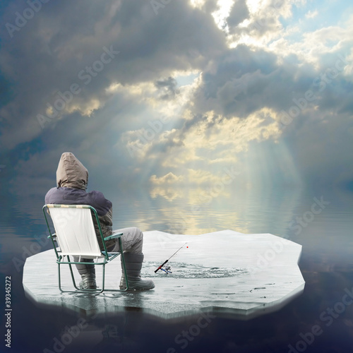 Photo: Funny picture of a ice fisherman floating on a iceberg. Funny picture of a ice fisherman floating on a iceberg.