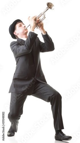 Photo: Portrait of a young man playing his Trumpet Portrait of a young man playing his Trumpet