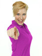 Pretty blonde woman points her finger at you