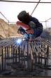 Photo: worker is welding work in a construction site worker is welding work in a construction site
