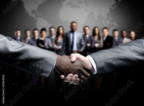 Photo: handshake isolated on business background handshake isolated on business background