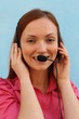Redhead pretty woman with headset