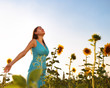 Happy woman in sunflower field Happy woman in sunflower field