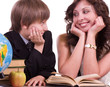 Little schoolboy with mother with book, apple and globe
