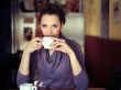 Young woman drinking coffee