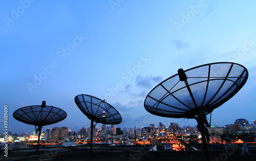 Photo: black antenna communication satellite dish over sunset sky in ci black antenna communication satellite dish over sunset sky in ci