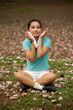 Pretty Thai woman rest exercise in the park .