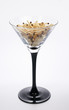 Glass for the martini, filled with matches on a white background Glass for the martini, filled with matches on a white background