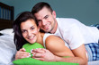 Happy young couple in bed Happy young couple in bed