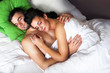 Young couple sleeping in a bed Young couple sleeping in a bed