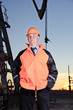 Photo: Worker in an oil field. Worker in an oil field.
