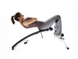 Woman using fitness machinery, white background Woman using fitness machinery, white background