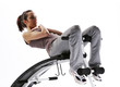 Photo: Woman using fitness machinery, white background Woman using fitness machinery, white background