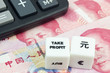 Chinese currency with calculator and dice showing TAKE PROFIT
