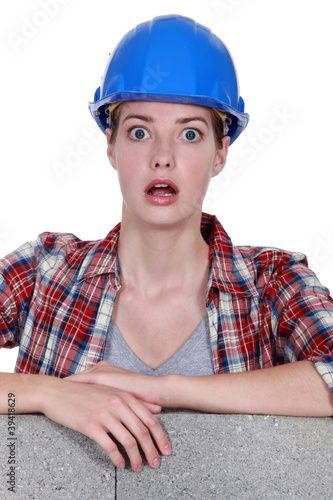 Photo: A wide-eyed tradeswoman A wide-eyed tradeswoman
