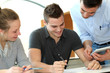 Photo: Teacher helping students with assignment Teacher helping students with assignment