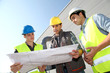 Young people in professional training on industrial site